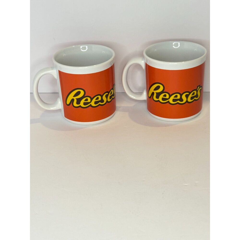Reese’s Coffee Mug Set Lot of 2 Orange Ceramic Cups Galerie Peanut Butter Candy